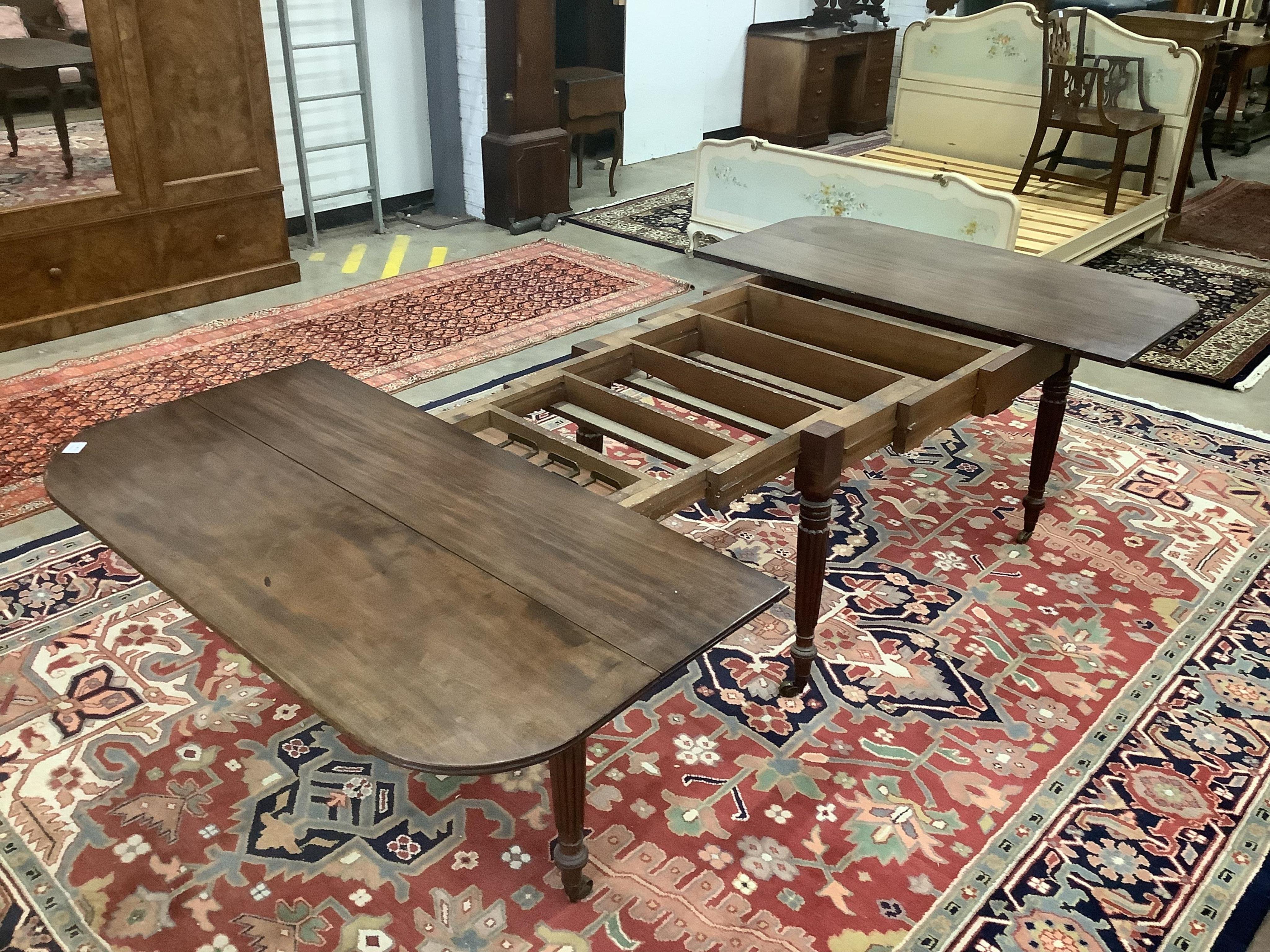 A Regency Gillows style mahogany extending dining table, 276cm extended, three spare leaves, depth 137cm, height 71cm. Condition - fair